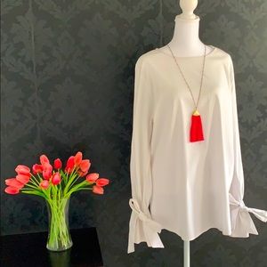 Oversized white cotton blouse.